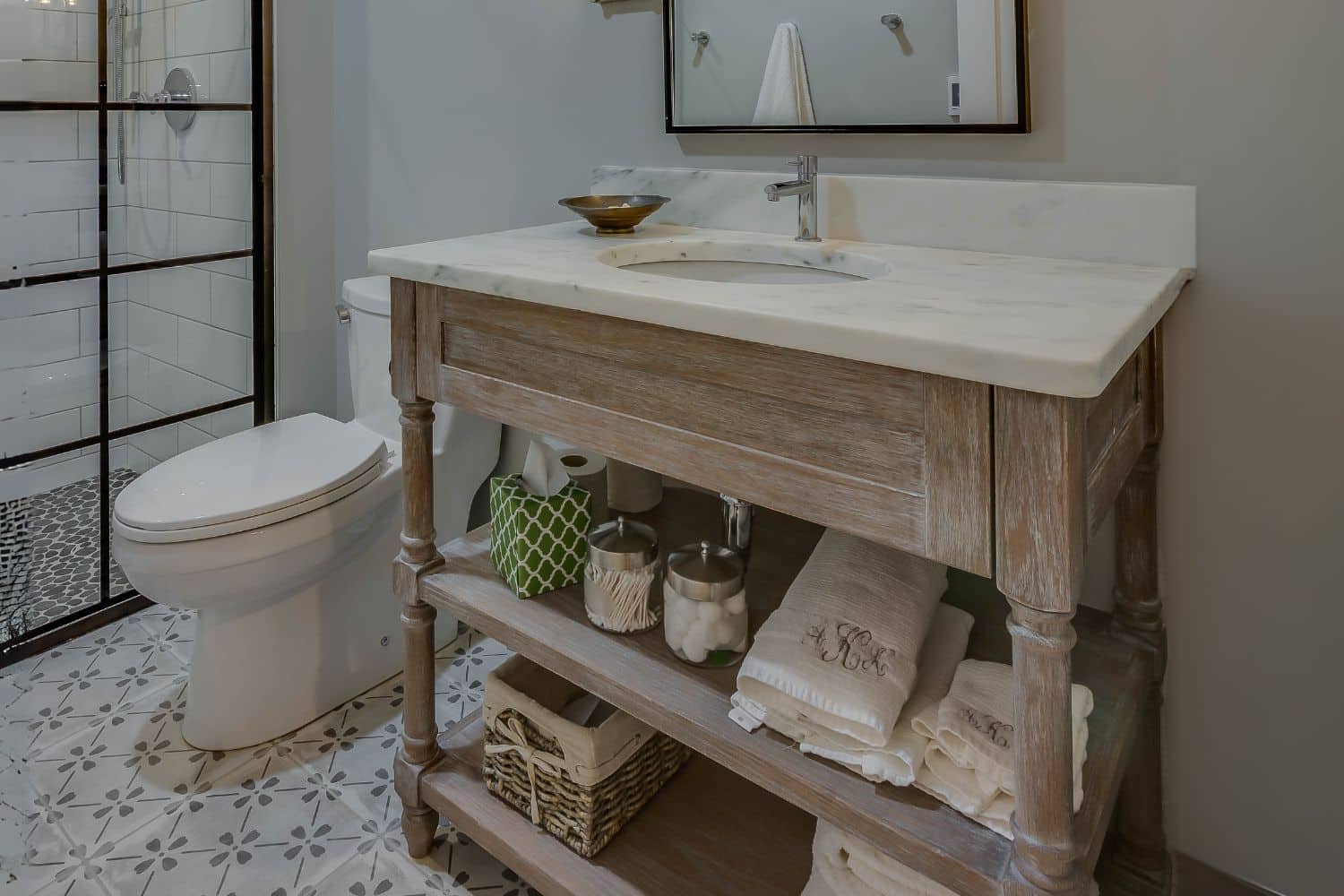 Custom sink cabinets, drawer, and open storage in bathroom in granger Indiana