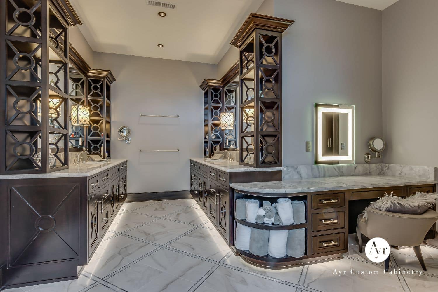 Custom bathroom cabinets with view of seating, shelves, and cabinets