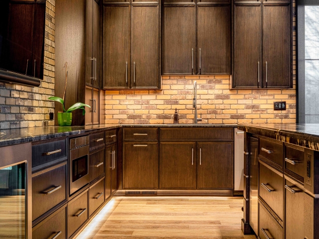 Wooden kitchen cabinets with light brown floor