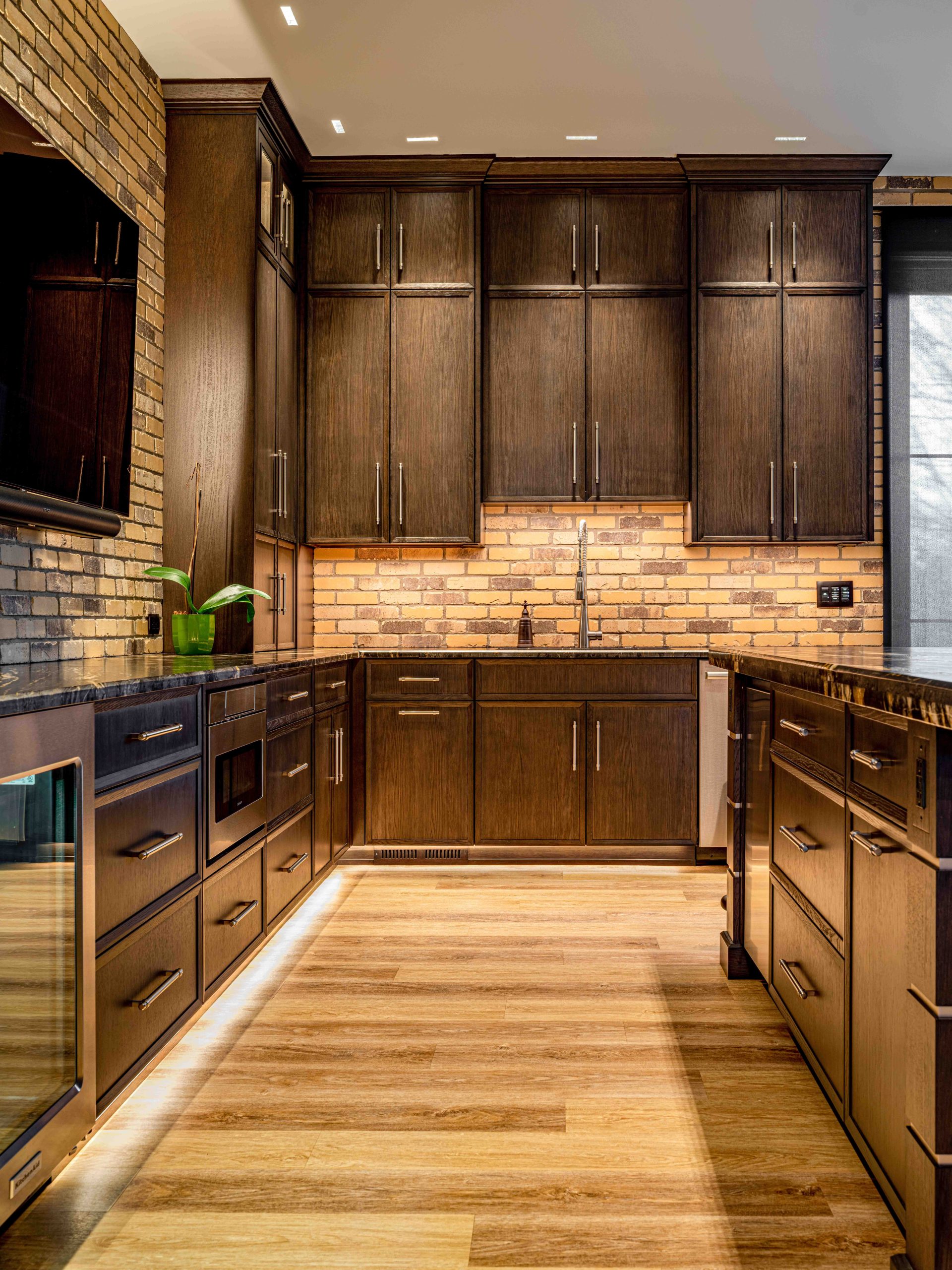 Wooden kitchen cabinets with light brown floor