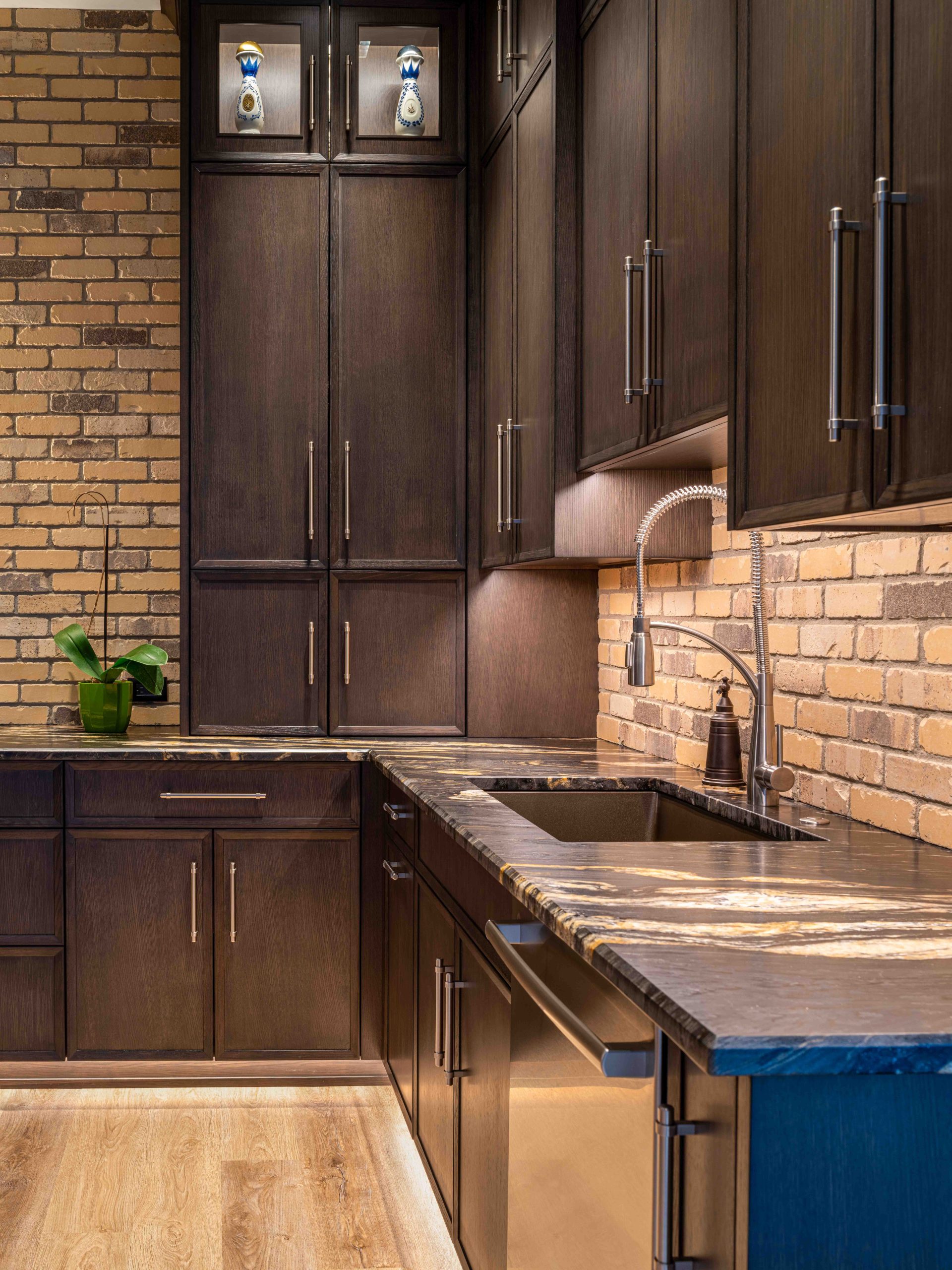 Wooden kitchen cabinets with black countertops