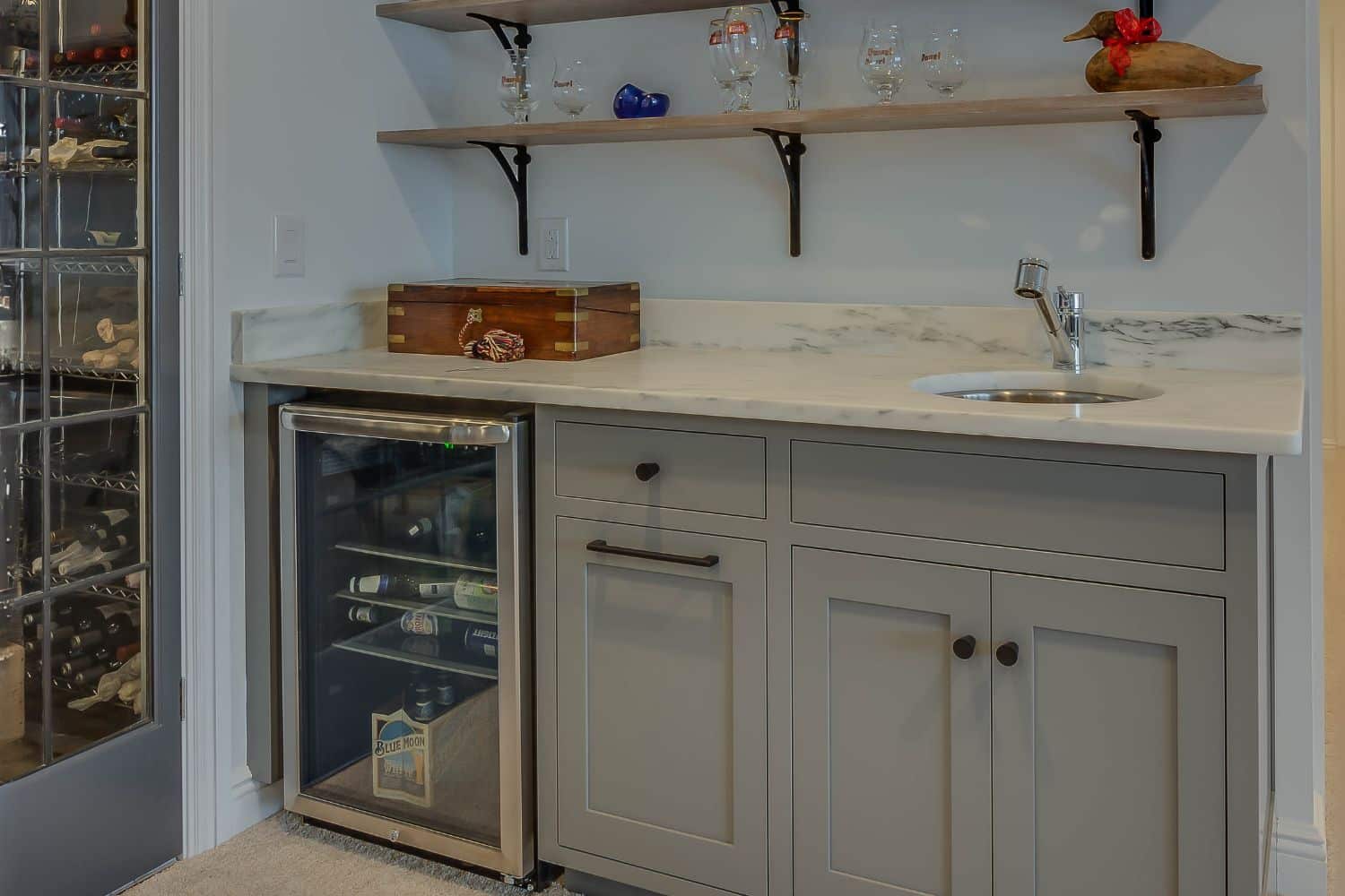 Custom wet sink with fridge and shelving