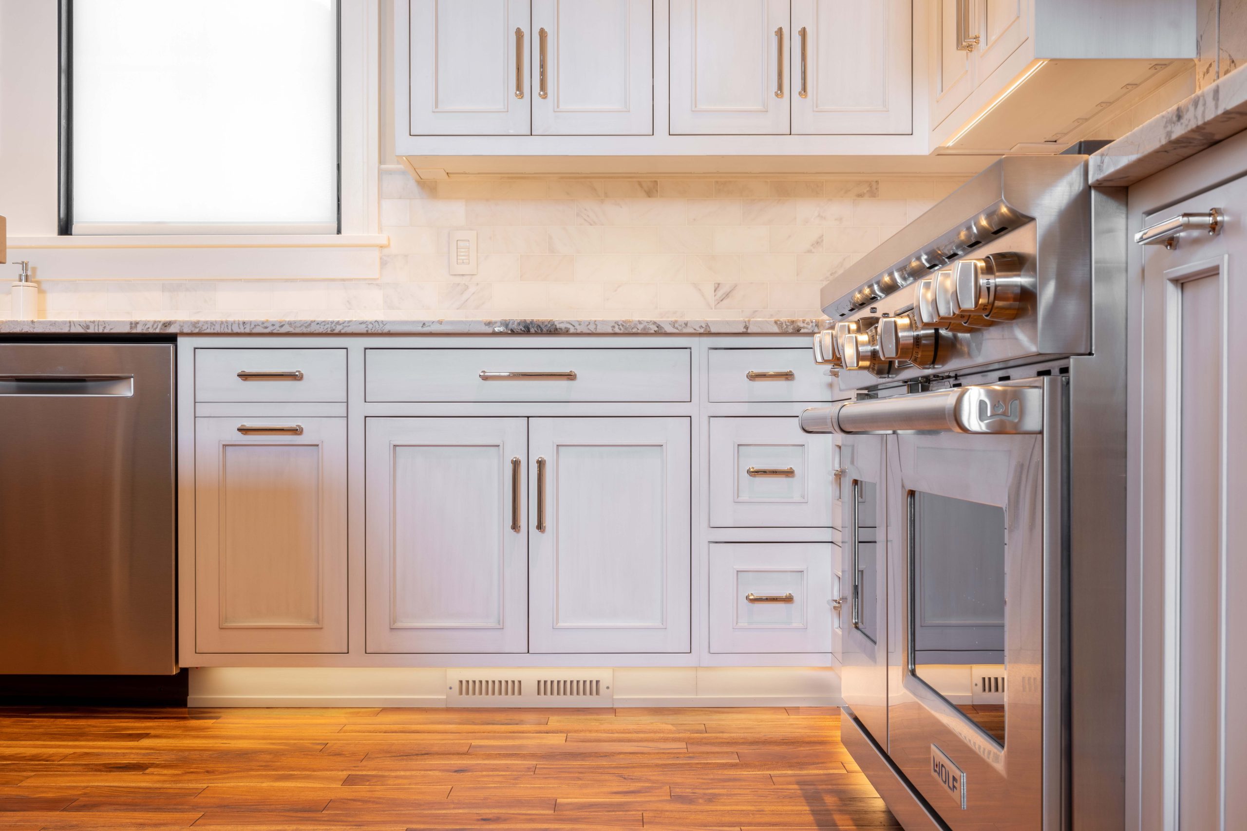 Low shot of grey inset kitchen cabinets