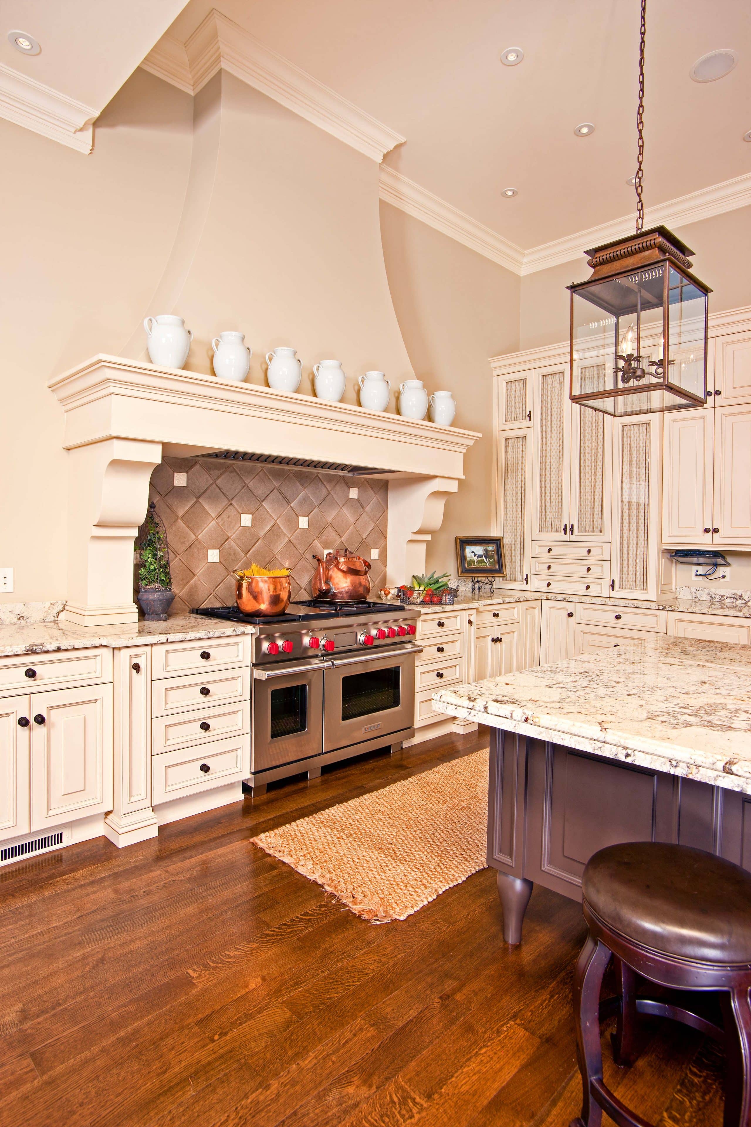 beautiful stove hood in custom kitchen cabinets in middlebury in