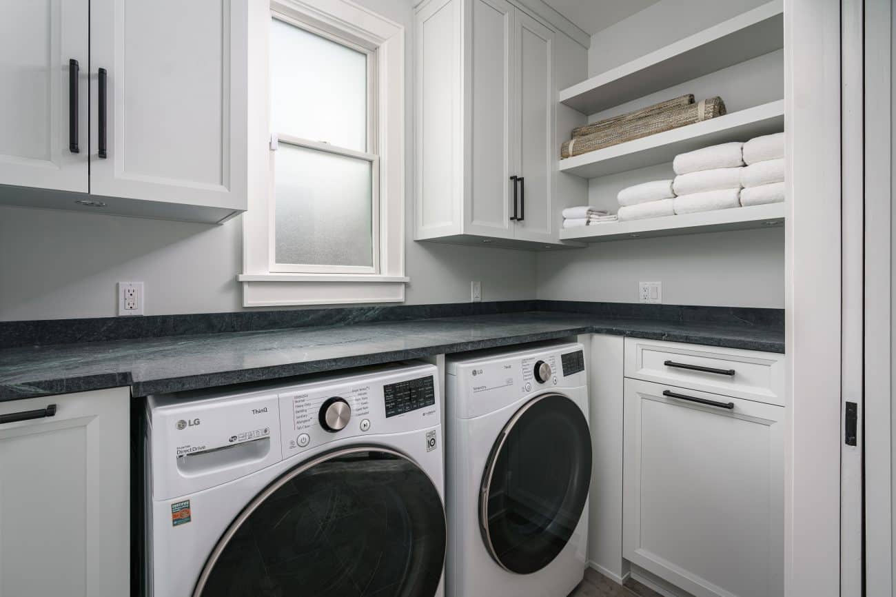 laundry room with white cabinets
