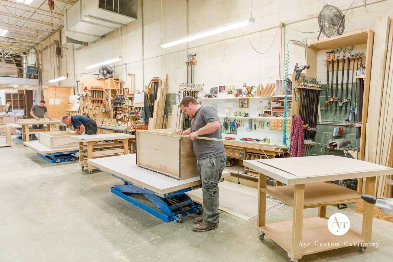 high end kitchen cabinets, men at work